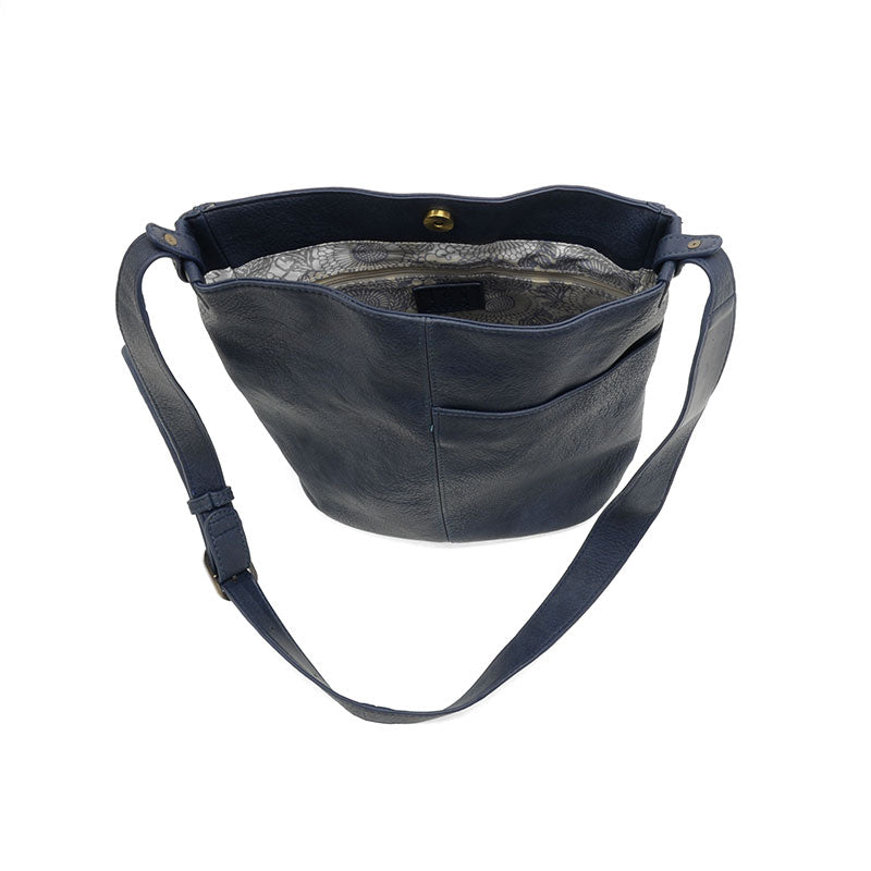 Navy vegan leather bucket handbag with gold accents opened against a white background.