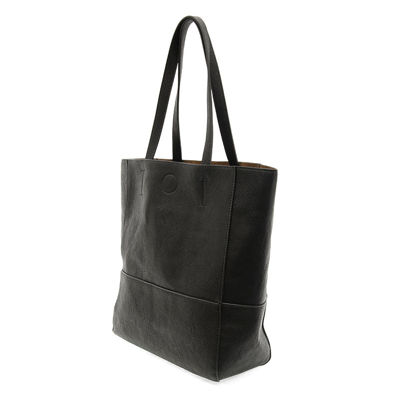 Black vegan leather raw edge tote against a white background.
