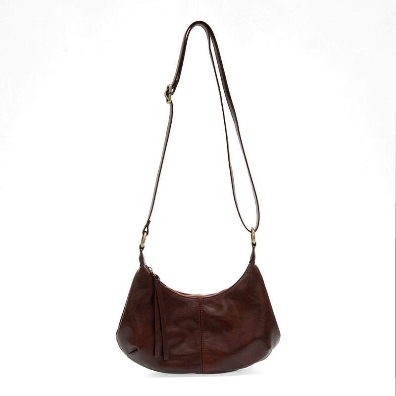 Maroon vegan leather shoulder bag against a white background.