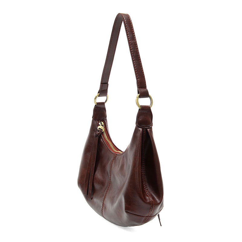 Maroon vegan leather shoulder bag against a white background.