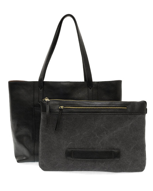 Black vegan leather laptop tote against a white background.