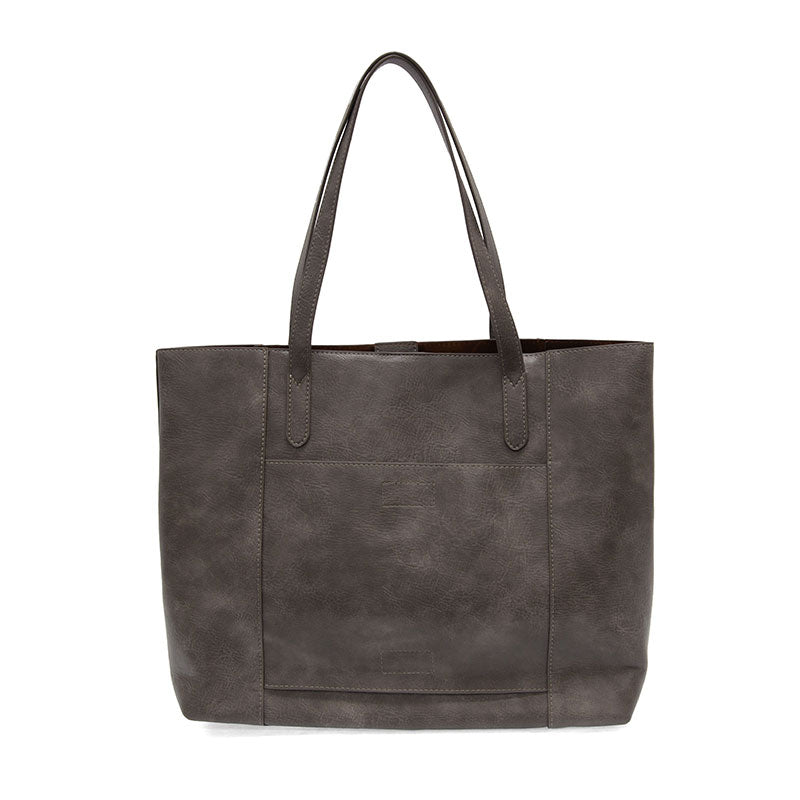 Taupe vegan leather laptop tote against a white background.