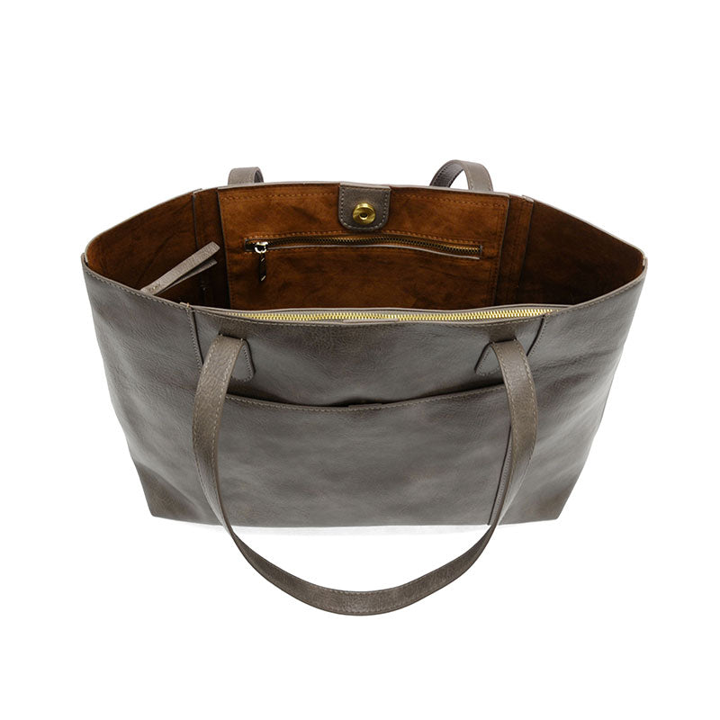 Taupe vegan leather laptop tote against a white background.