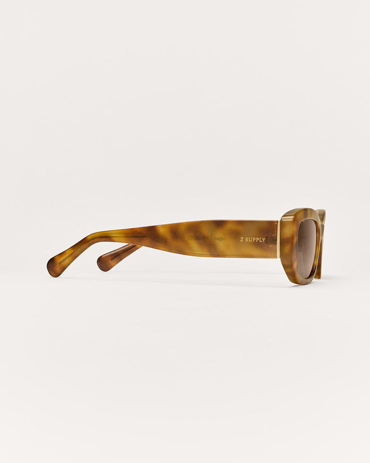 Sunglasses with tortoiseshell frame on a white background