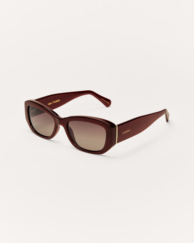 Brown sunglasses with a gradient lens on a white background