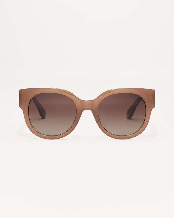 Brown sunglasses with gradient lenses on a white background