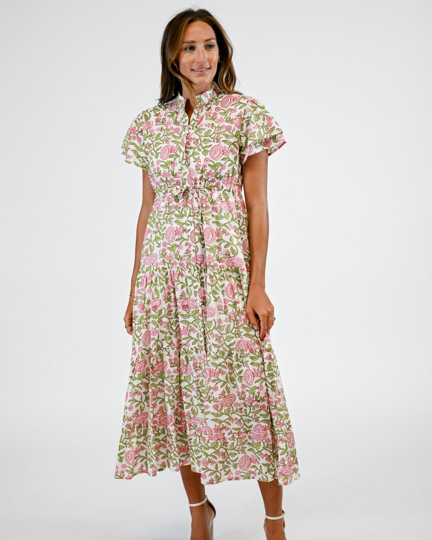 Woman wearing a floral dress on a white background