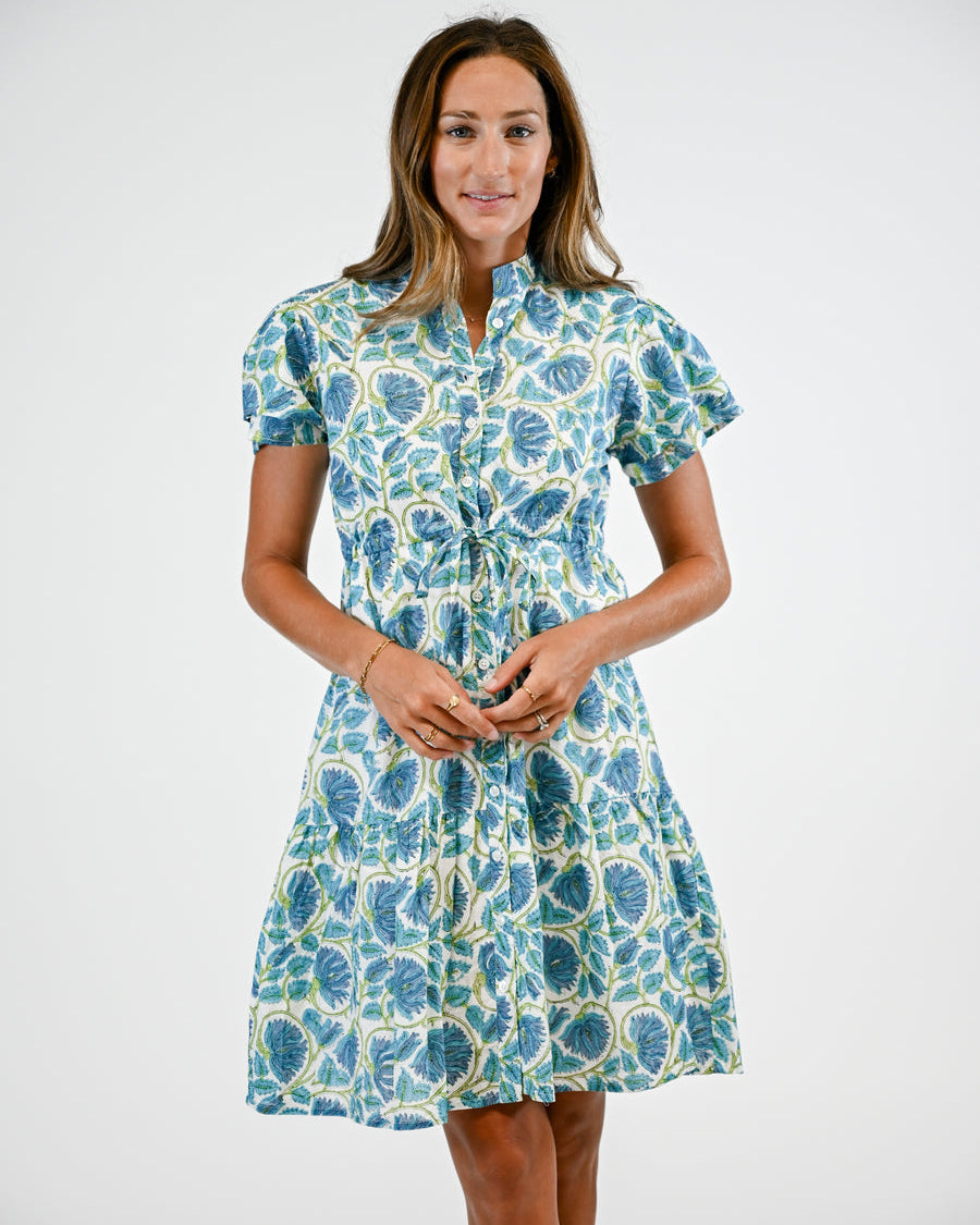 Woman wearing a floral dress on a white background