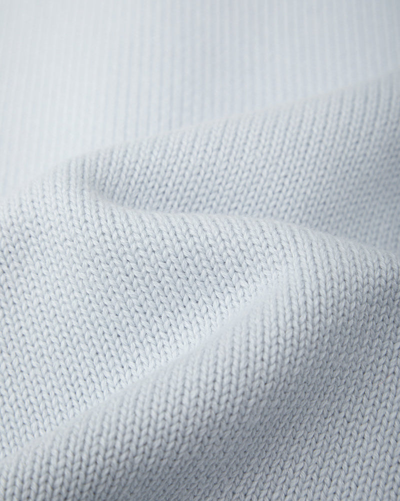 Close-up of light gray fabric texture