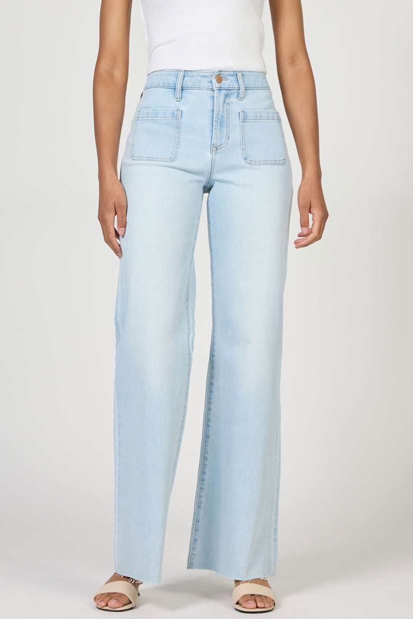 Light blue jeans worn by a person on a white background