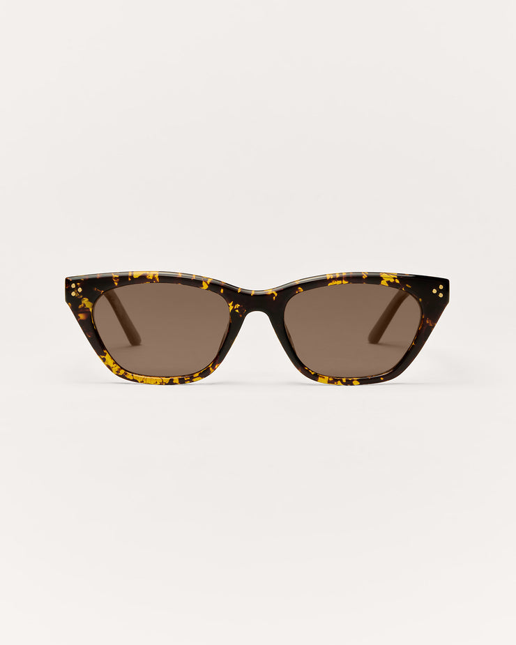 Sunglasses with tortoiseshell frame and dark lenses on a white background