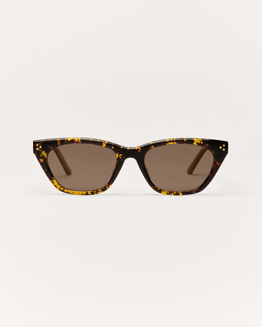 Sunglasses with tortoiseshell frame and dark lenses on a white background