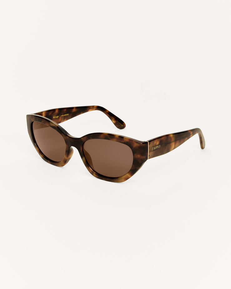 Tortoiseshell sunglasses with brown lenses on a white background