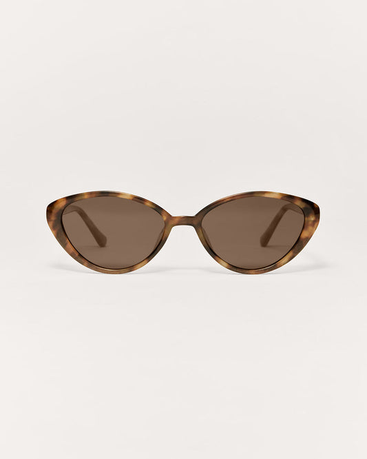 Cat-eye sunglasses with tortoiseshell frame on a white background