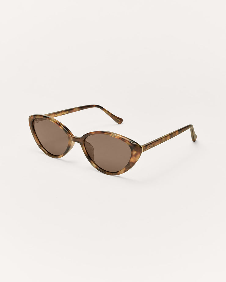 Cat-eye sunglasses with tortoiseshell frame on a white background