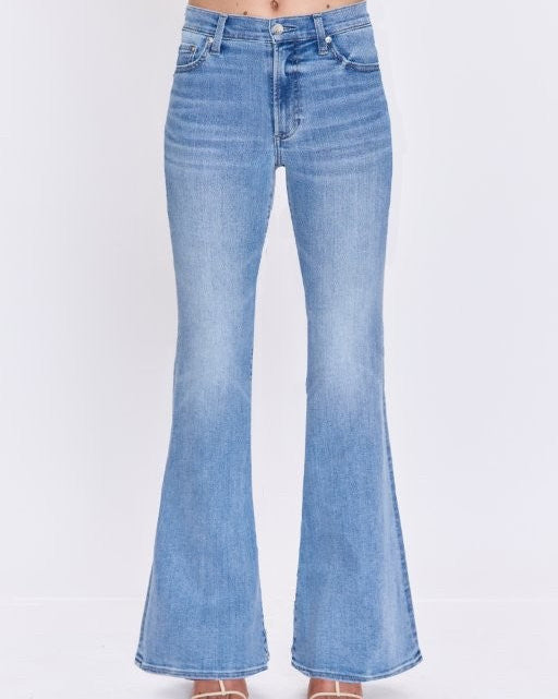 Light blue flared jeans on a white background