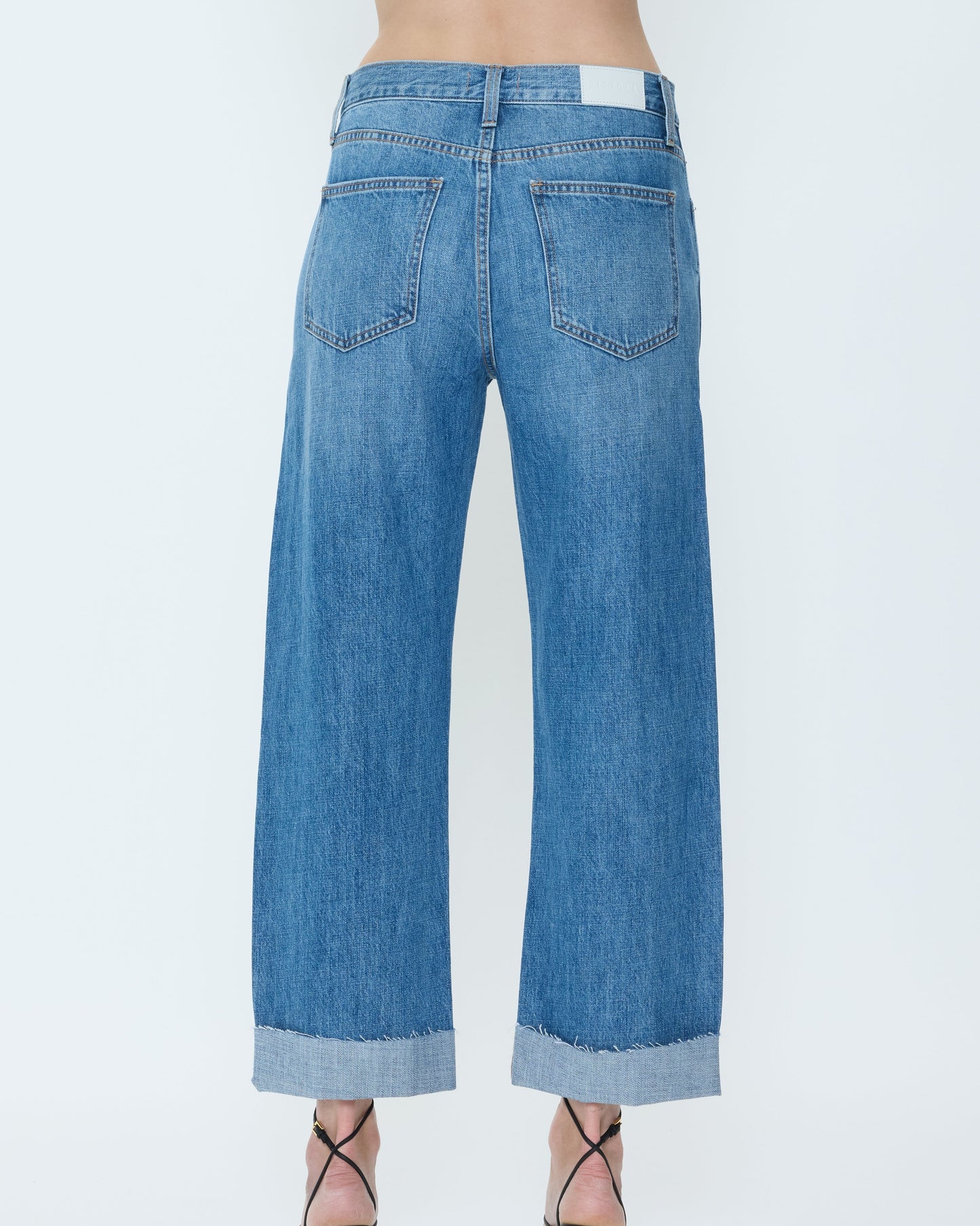 Blue jeans with a white background