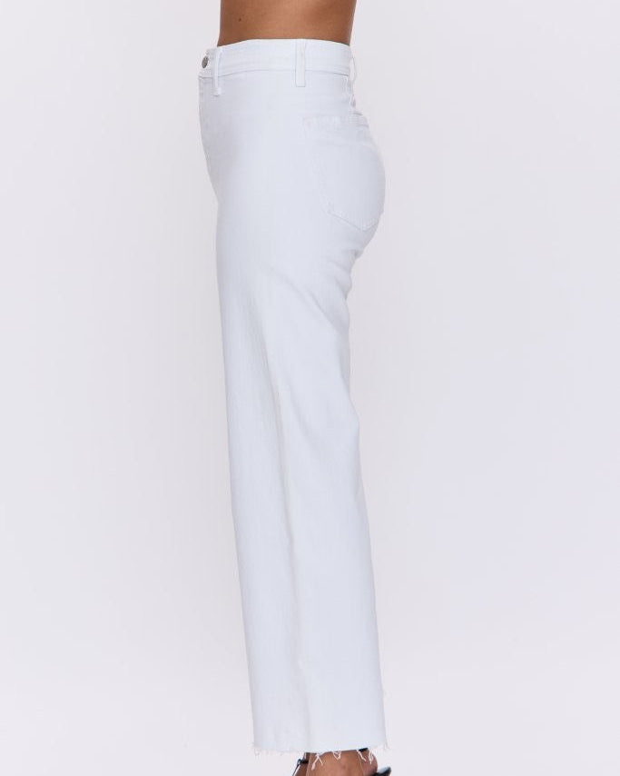 White pants worn by a person on a white background