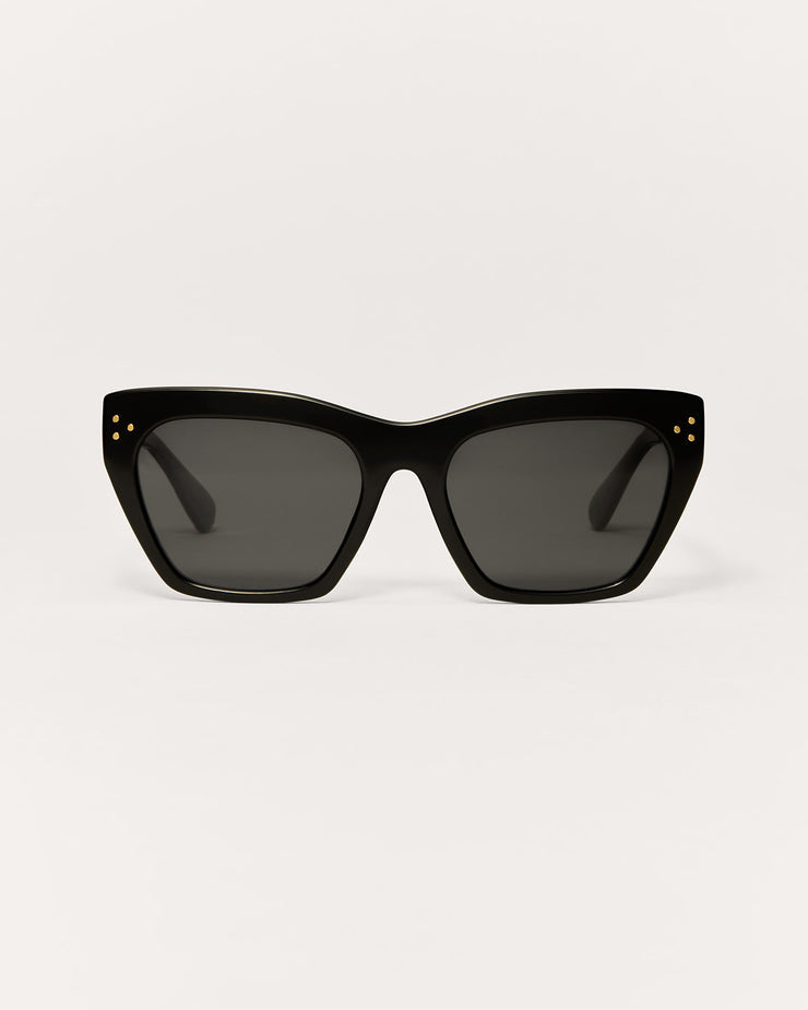 Black cat-eye sunglasses on a light gray background