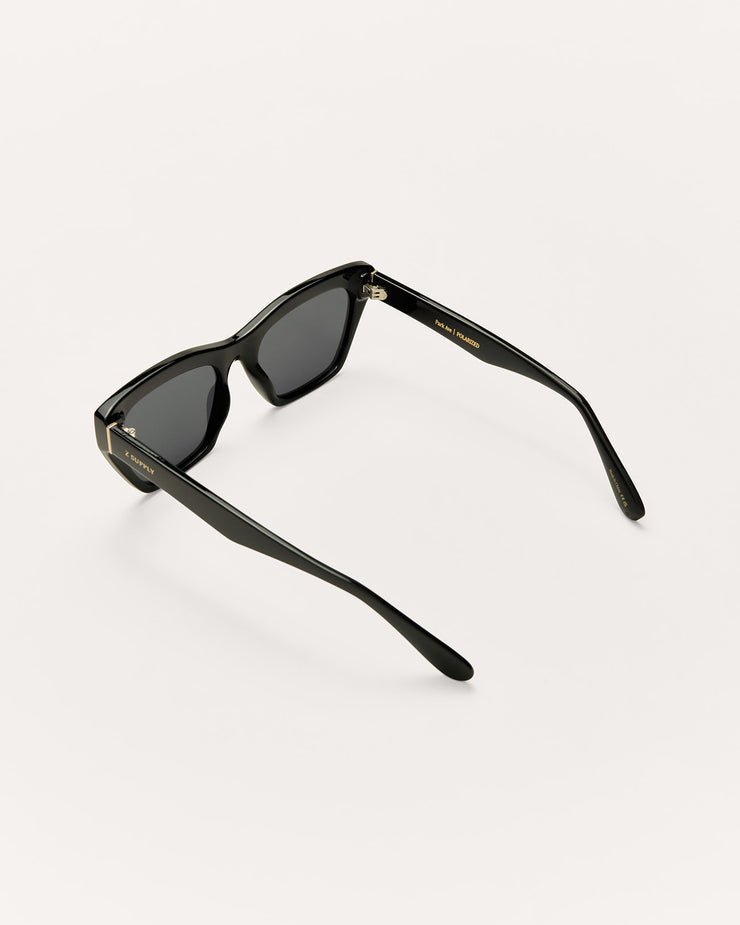 Black sunglasses with dark lenses on a white background