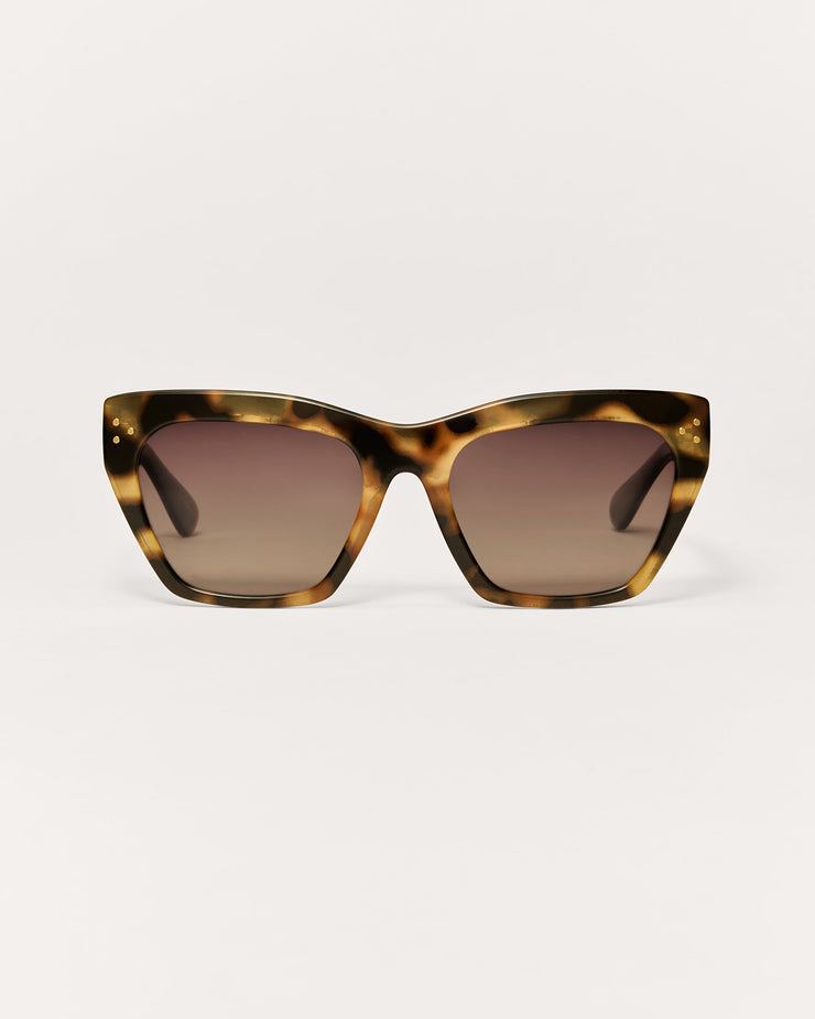 Sunglasses with tortoiseshell frame and brown lenses on a white background