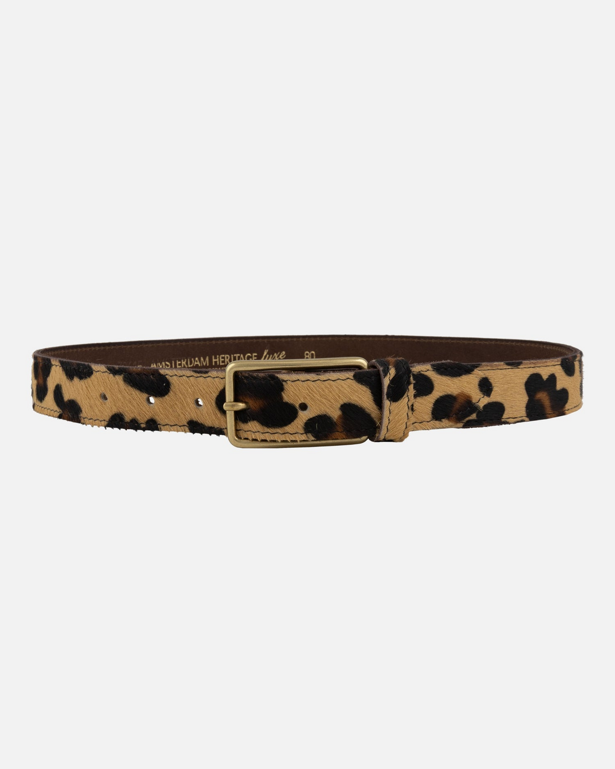 A leopard print belt with a tan base, black spots, and a gold-tone metal buckle, shown against a plain light gray background.