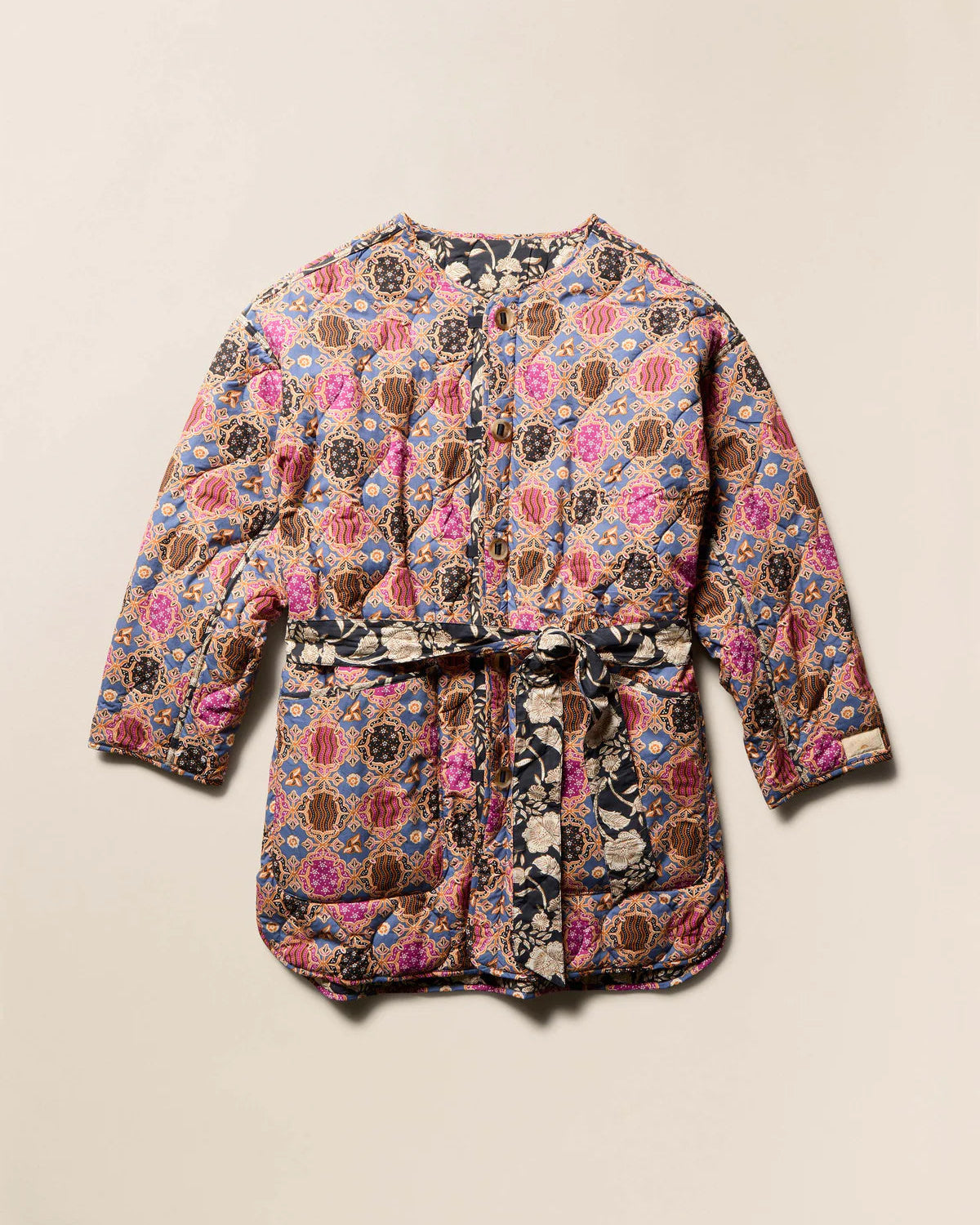 Floral patterned jacket on a beige background