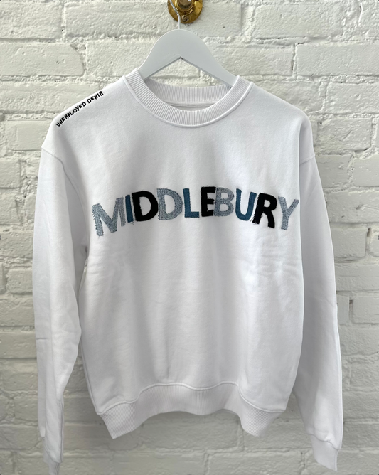 Image Of MIDDLEBURY Vermont White Denim Letter Sweatshirt On A White Brick Background