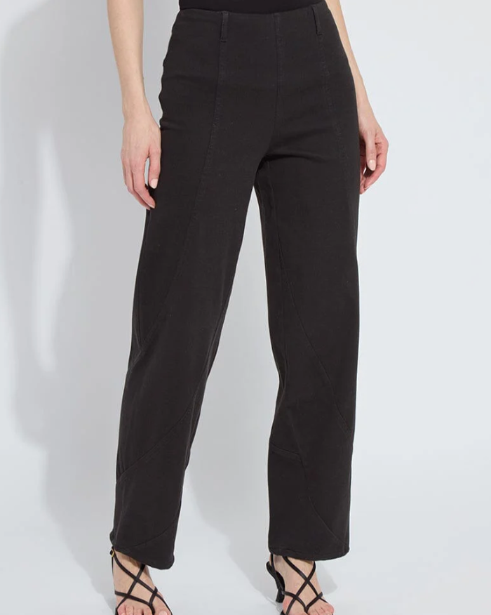 Black pants worn by a person on a white background