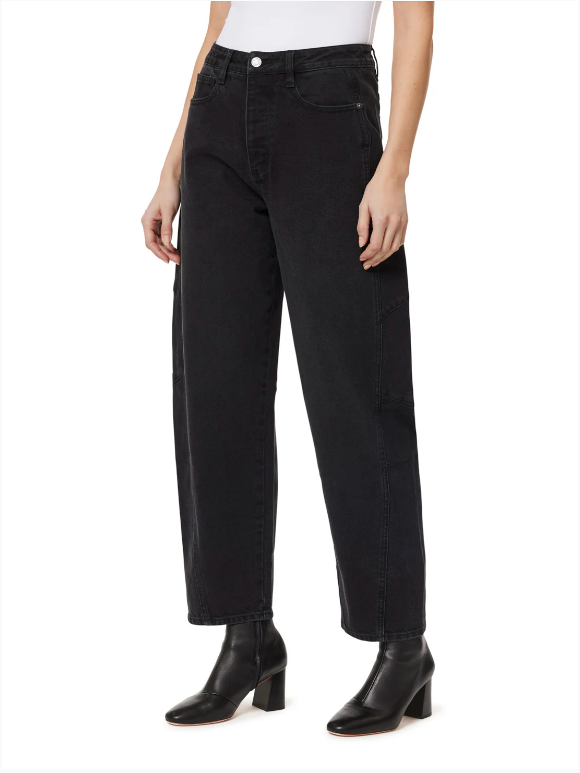 Person wearing black jeans on a white background