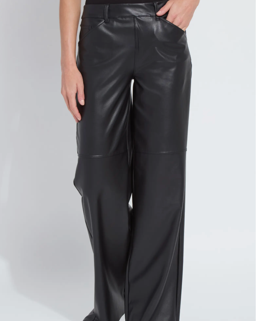 Black leather pants worn by a person on a white background