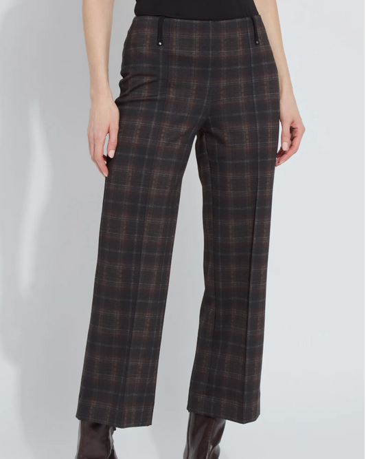 Plaid pants worn by a person on a white background