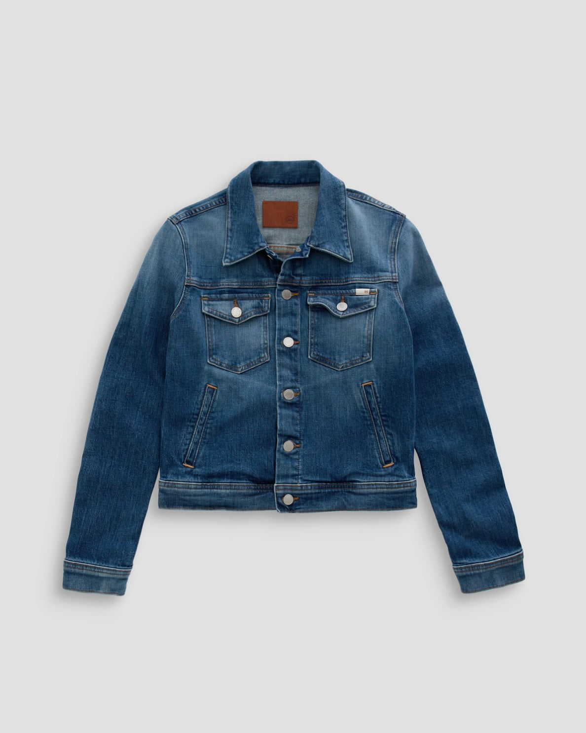 Blue denim jacket on a light gray background