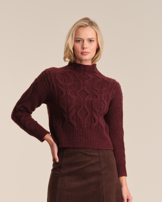 Model is wearing 525 America REBA CABLE FUNNEL NECK PULLOVER in color OXBLOOD