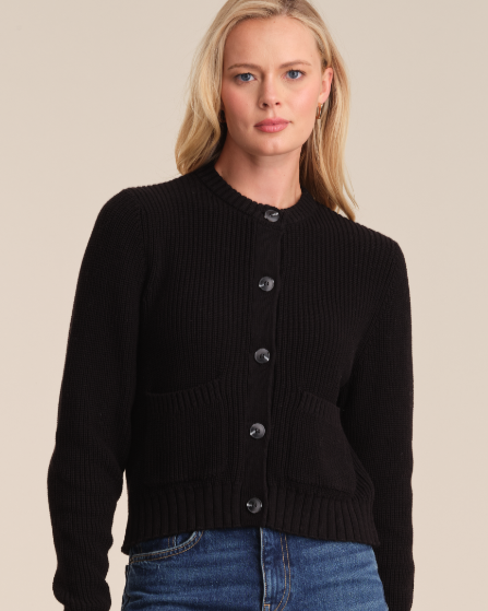 Model is wearing 525 America PALMER CREW NECK CARDIGAN in color BLACK