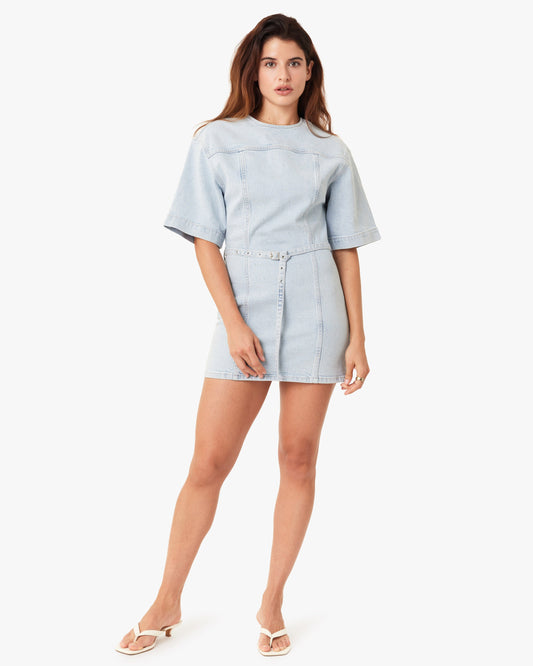 Woman wearing a light blue outfit on a white background