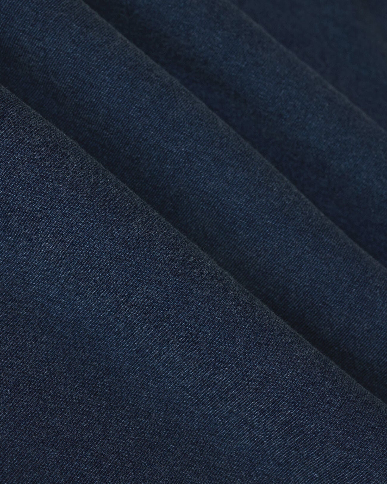 Close-up of dark blue fabric with a subtle texture