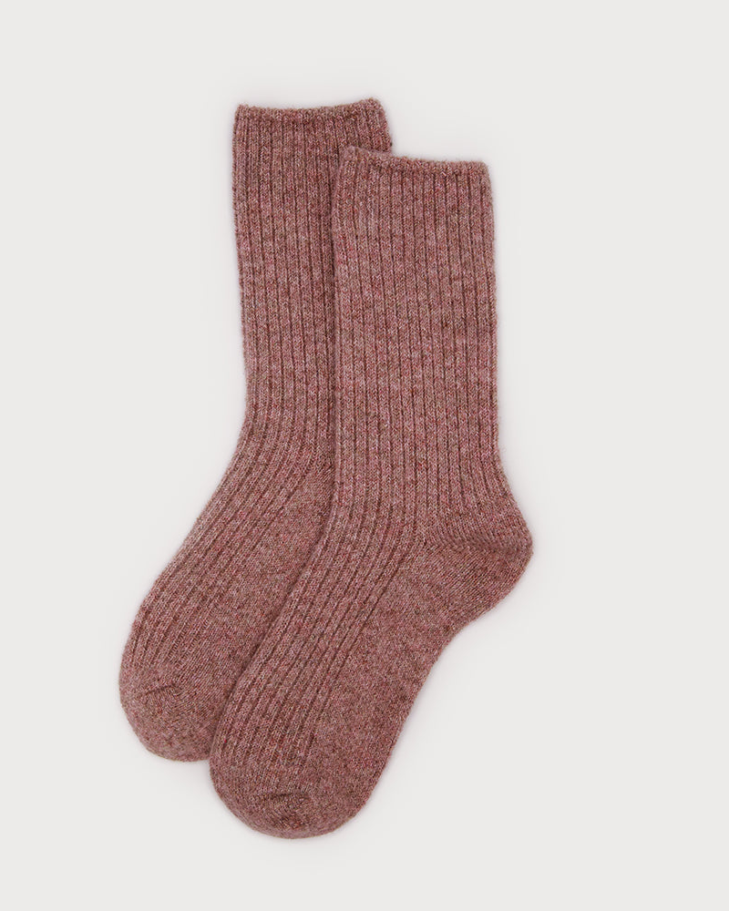 Pair of brown socks on a light gray background