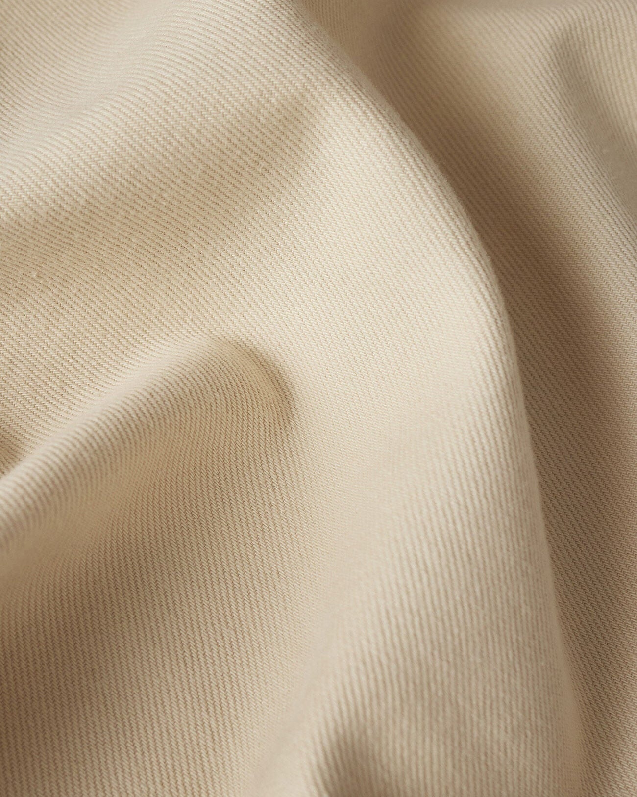 Close-up of beige fabric with folds