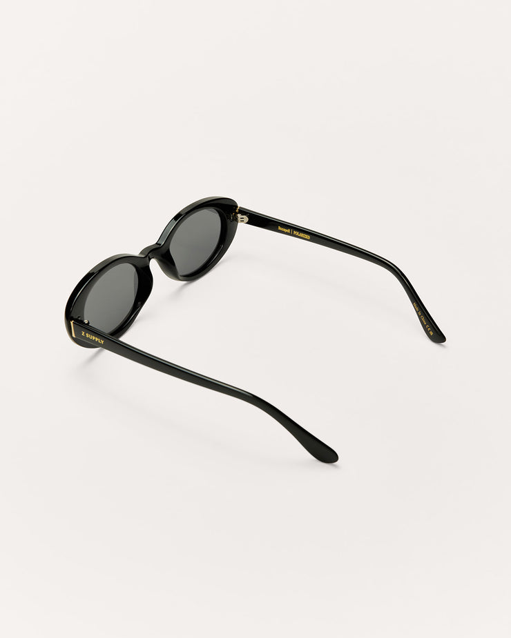 Sunglasses with blue lenses and metallic frame on a white background