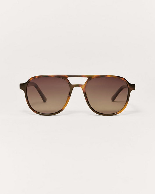 Sunglasses with a tortoiseshell frame on a white background