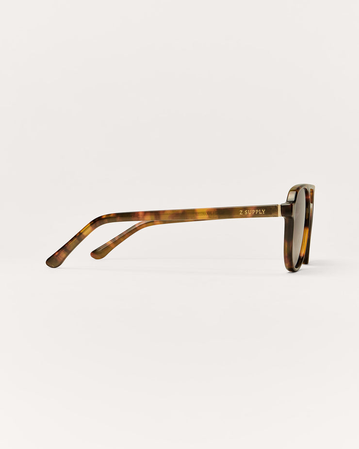 Sunglasses with tortoiseshell frame on a white background