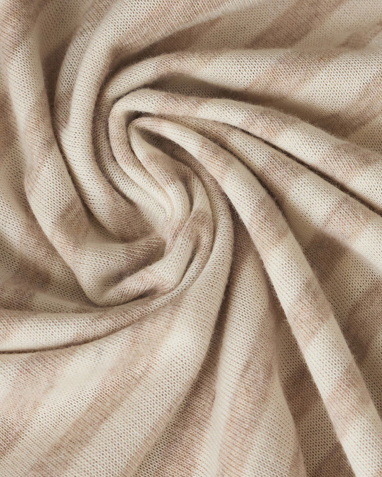 Close-up of beige fabric with folds