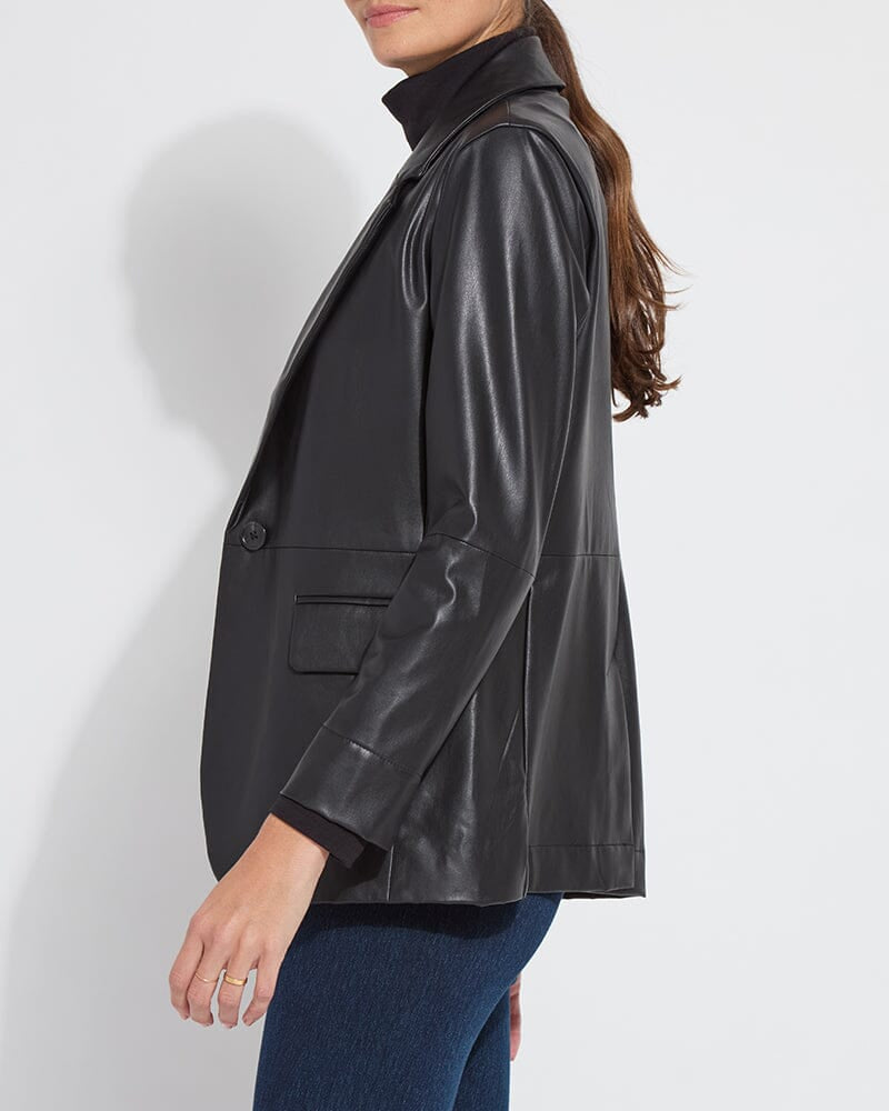 Woman wearing a black leather jacket on a white background