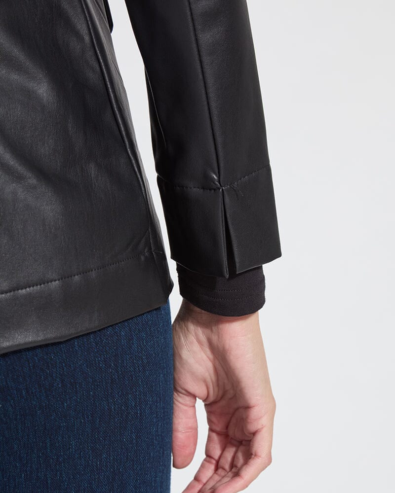 Close-up of a person wearing a black jacket with a white background