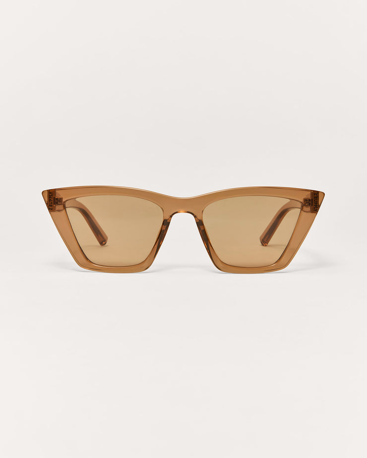 Brown sunglasses on a light beige background