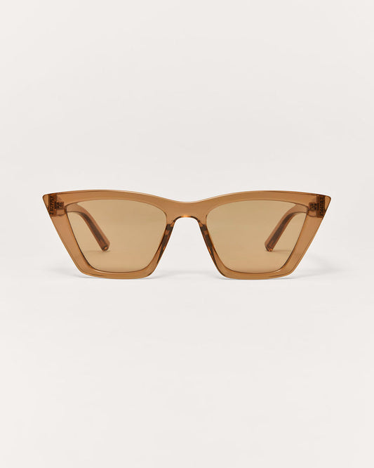 Brown sunglasses on a light beige background