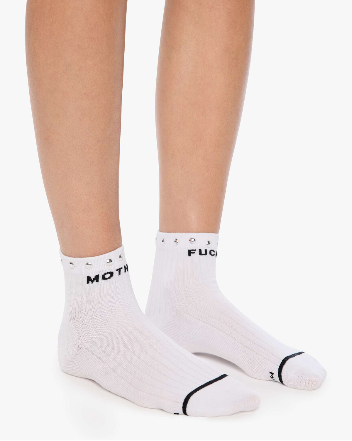 White socks with black text worn by a person on a white background