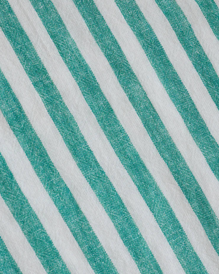Close-up of fabric with green and white diagonal stripes