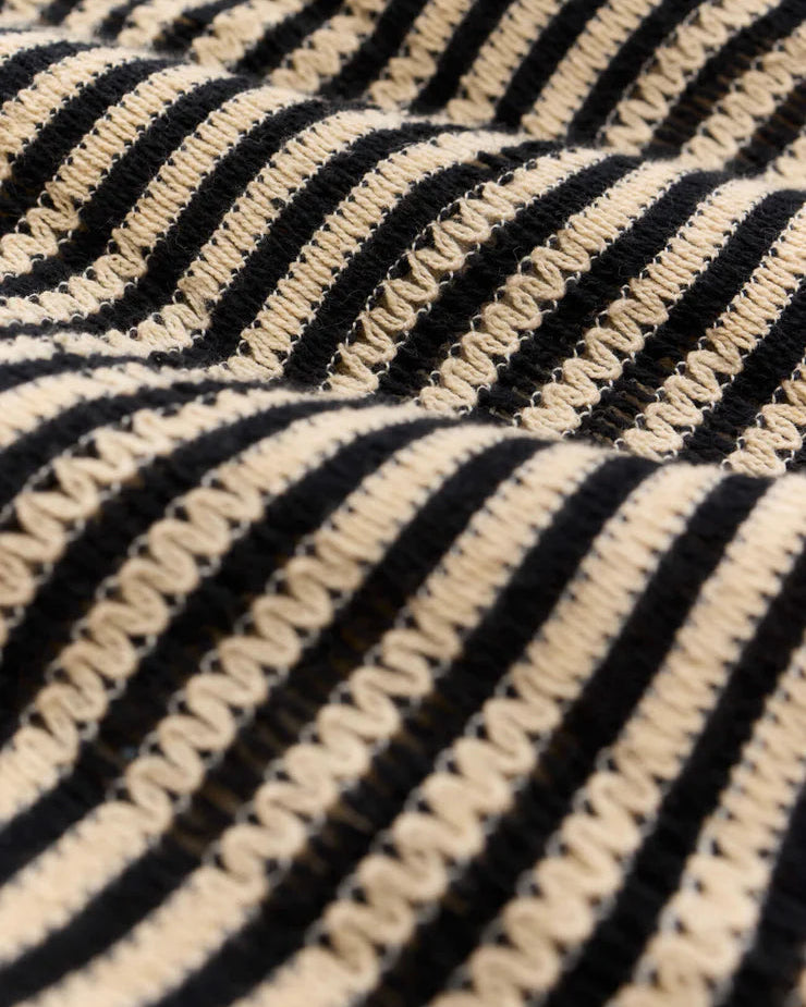 Close-up of black and beige striped fabric texture